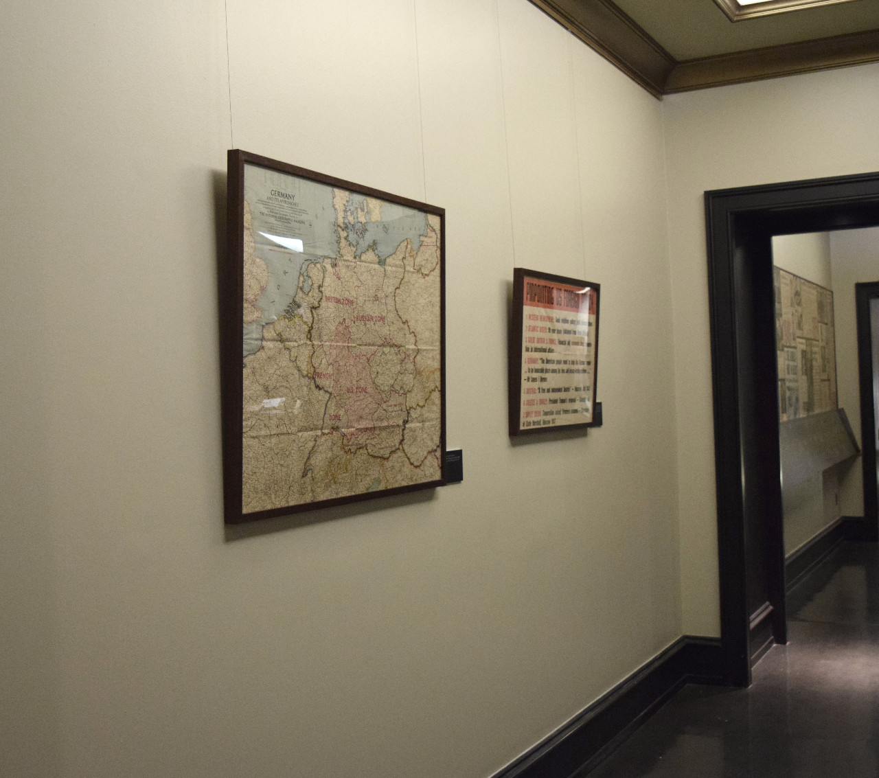 Bay 2 wall with map and policy poster